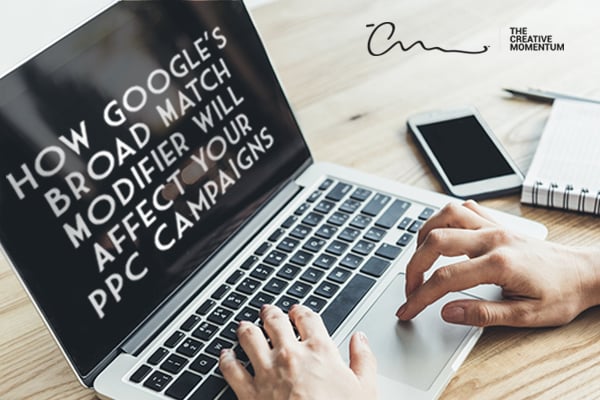 Recent updates to Google's Broad Match Modifier may spell changes for PPC marketing strategy. Hands type on a laptop on a desk