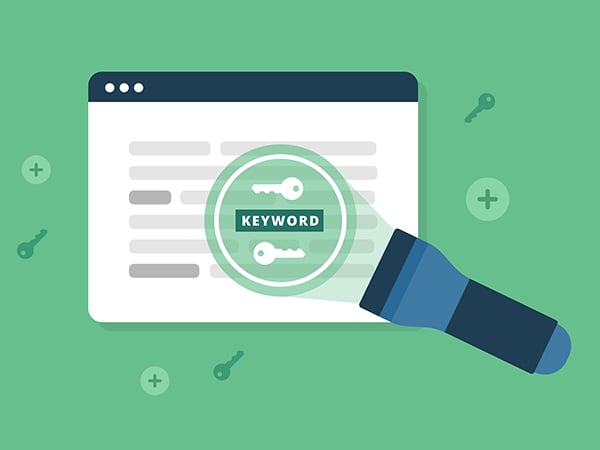 Your keyword strategy is a foundational element of good B2B PPC marketing campaigns - a flashlight shines on a webpage's 'keyword'