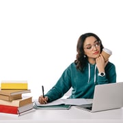 Understanding user intent – educational users seek ongoing education to achieve their goals. Woman with coffee cup works on her laptop