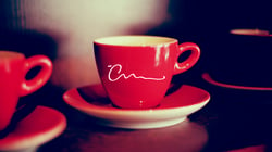 Branding is important. The Creative Momentums logo is featured on a coffee cup