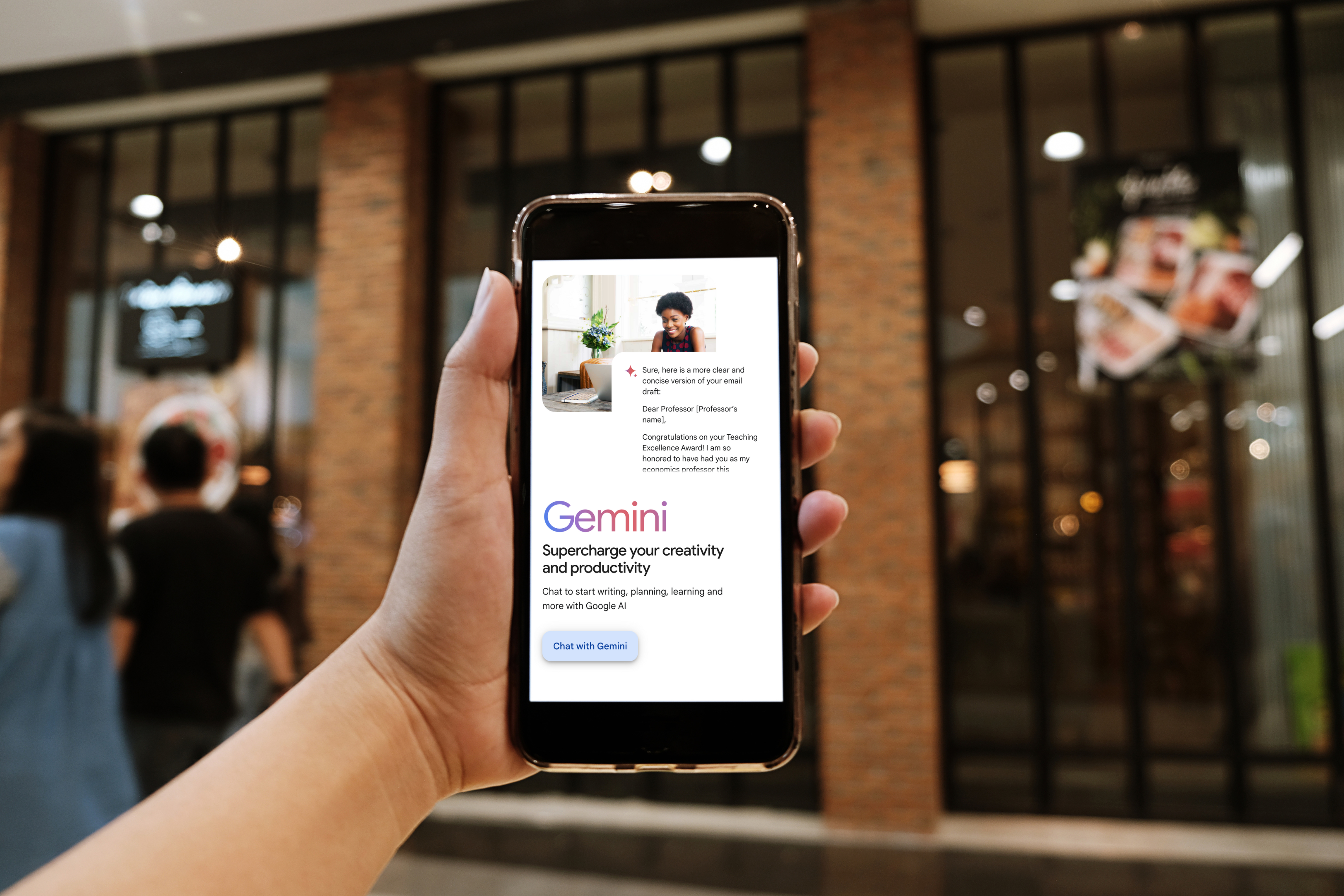 Hand holding smartphone displaying Google Gemini, symbolizing modern AI interaction tools