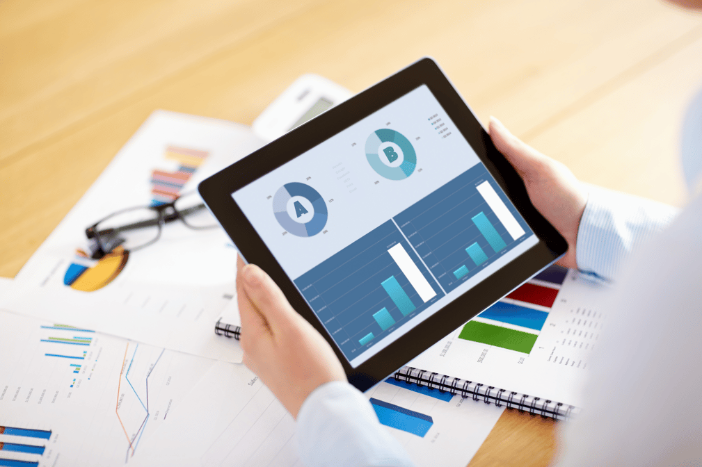 Business professional analyzing A/B test results on digital screen