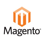 Adobe's CMS is called Magento. Magento logo - orange cube with "M," "Magento" in black.