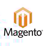 Adobe's CMS is called Magento. Magento logo - orange cube with "M," "Magento" in black.