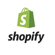 Shopify is a great CMS choice if you need eCommerce capabilities. Shopify logo - green bag with "S," "Shopify" in black.