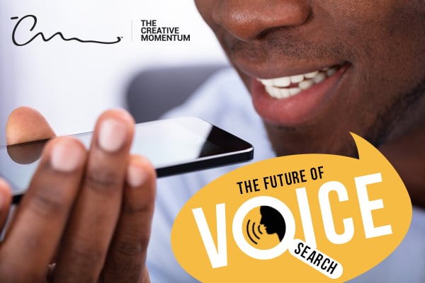 Voice search via smart phones and personal assistants is the future. A man holds his phone up to his mouth.