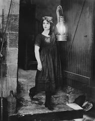 Hopefully your site navigation doesn't require a torch and map. [vintage photo] Lady, looking lost, holds up a large lantern.