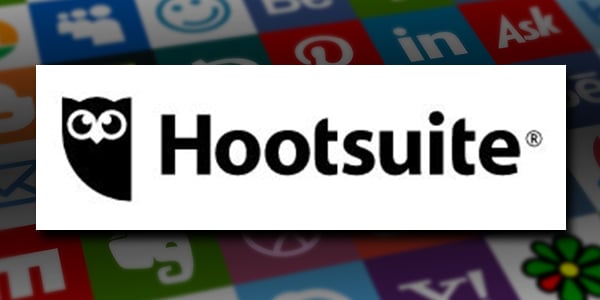 Hootsuite is one of the best social media marketing tools. Hootsuite's logo over a background grid of social media icons.