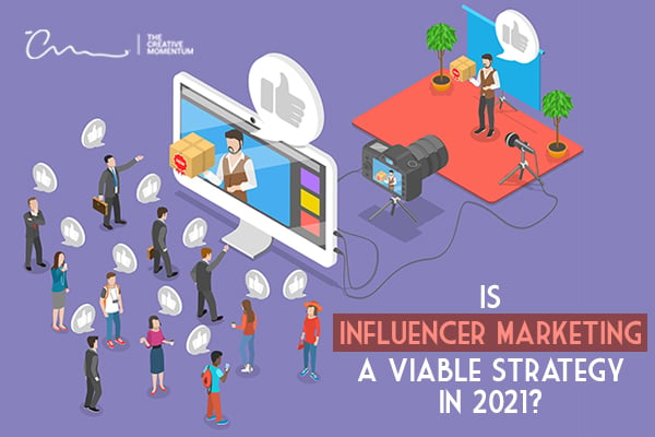 Is influencer marketing a viable strategy in 2020? - Influencer in front of a camera speaking to a crowd