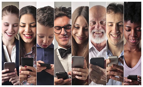 How do you appeal to the majority of users? Start your design in mobile view. Multiple people looking at their phones.