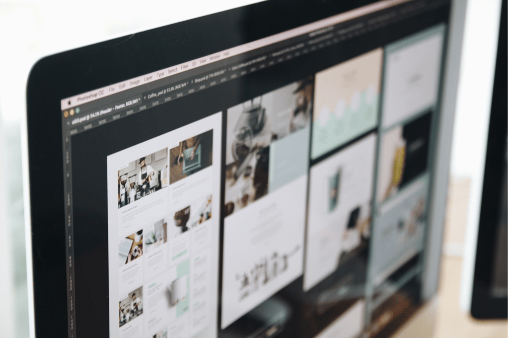 Designer using a program for wireframe layouts, representing digital prototyping in UI/UX design